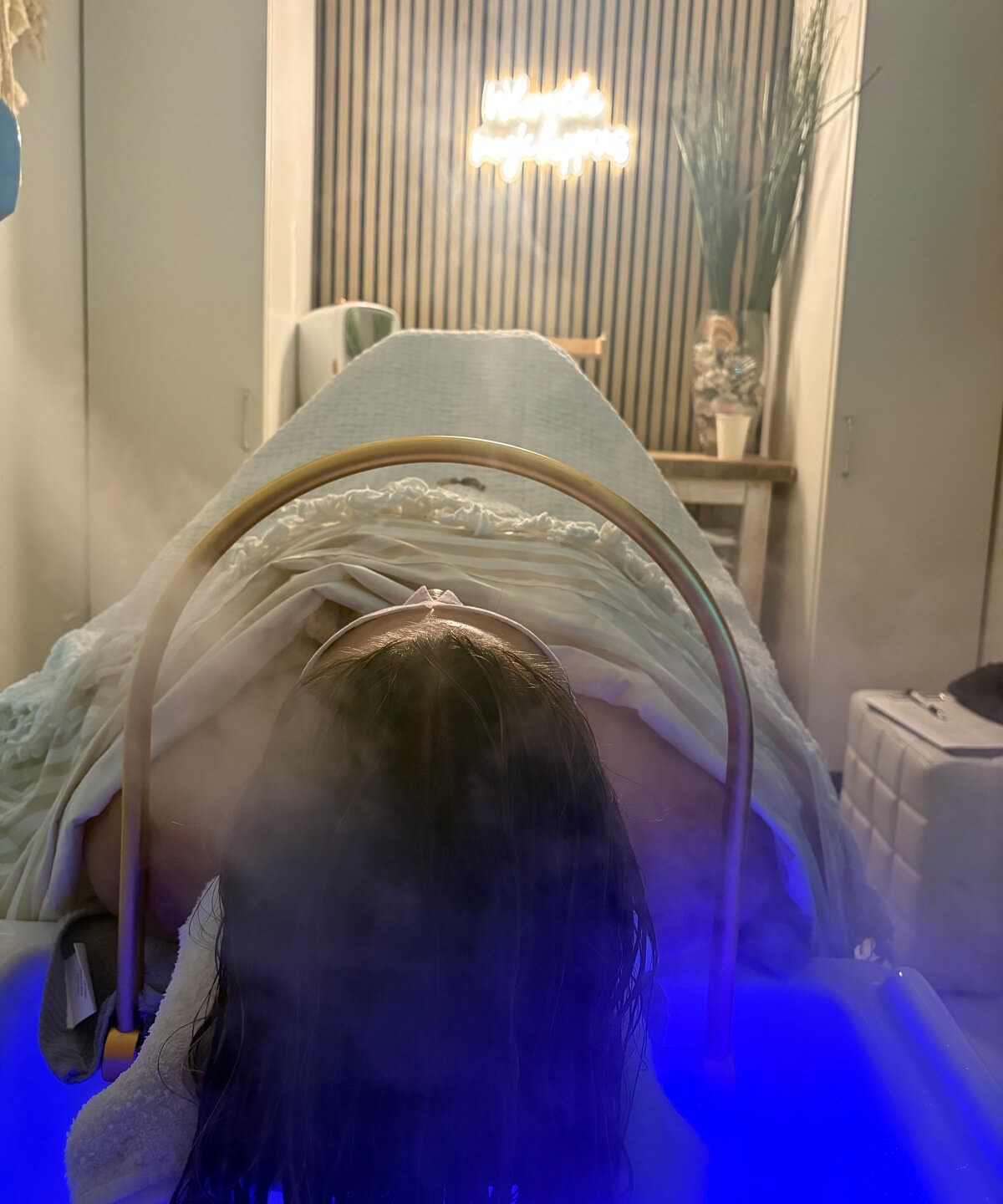 A guest receiving a scalp treatment at White Sand Salon